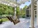 Outdoor seating with porch swing overlooking luscious greenery at 827 Museum Dr, Charlotte, NC 28207