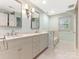 Elegant bathroom with double sinks, a chandelier, and a bathtub at 827 Museum Dr, Charlotte, NC 28207