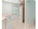 Bathroom with marble-tiled shower and travertine floors at 827 Museum Dr, Charlotte, NC 28207