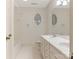 Well-lit bathroom features double vanity and tile flooring at 827 Museum Dr, Charlotte, NC 28207