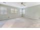 Spacious bedroom with lots of windows providing ample light plus a ceiling fan at 827 Museum Dr, Charlotte, NC 28207
