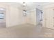 Spacious bedroom features neutral carpet, windows, and ample closet space at 827 Museum Dr, Charlotte, NC 28207
