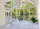 Enjoy the view from this screened-in porch with high ceilings and ceiling fan at 827 Museum Dr, Charlotte, NC 28207
