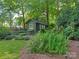 Charming backyard shed with lush garden surroundings, offering a peaceful and private retreat at 827 Museum Dr, Charlotte, NC 28207