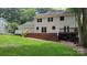 Back exterior showing a spacious deck, large backyard, and ample room to relax at 9424 Whitethorn Dr, Charlotte, NC 28277