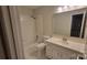 Bright bathroom features a tub-shower combination, vanity with sink, and tiled flooring, creating a functional space at 9424 Whitethorn Dr, Charlotte, NC 28277