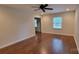 Light-filled bedroom with a ceiling fan and a view of the outdoors at 9424 Whitethorn Dr, Charlotte, NC 28277