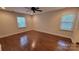 Sunlit bedroom with a ceiling fan, neutral walls, and comfortable ambiance at 9424 Whitethorn Dr, Charlotte, NC 28277