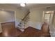 Inviting foyer featuring wood floors, and staircase to upper level at 9424 Whitethorn Dr, Charlotte, NC 28277