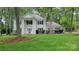 Beautiful two-story home with a well-maintained lawn and distinguished architectural elements at 9424 Whitethorn Dr, Charlotte, NC 28277