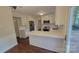 Updated kitchen featuring white cabinets, stainless steel appliances, and natural lighting at 9424 Whitethorn Dr, Charlotte, NC 28277