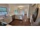 Lovely renovated kitchen with stainless steel appliances, white cabinets, and granite countertops at 9424 Whitethorn Dr, Charlotte, NC 28277