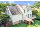 Two-story home featuring a wooden deck, a well-manicured yard, and a neutral exterior at 953 Milkwood Ln, Monroe, NC 28110