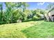 Spacious backyard with a storage shed and well-maintained lawn at 953 Milkwood Ln, Monroe, NC 28110