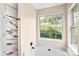 Bright bathroom featuring a soaking tub and a marble tiled shower at 953 Milkwood Ln, Monroe, NC 28110