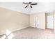 Bedroom with a ceiling fan, neutral walls, carpeted floor and a view to the hallway and other rooms at 953 Milkwood Ln, Monroe, NC 28110