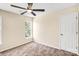 Neutral bedroom featuring a ceiling fan and natural light from a window at 953 Milkwood Ln, Monroe, NC 28110