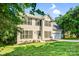 Charming two-story home with a well-manicured lawn, black shutters, and a two-car garage at 953 Milkwood Ln, Monroe, NC 28110