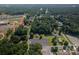Aerial view of home, nestled in a wooded lot at 110 Leeper Ave, Belmont, NC 28012