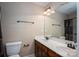 Bathroom featuring a double sink vanity, a large mirror, and a shower-tub combination at 110 Leeper Ave, Belmont, NC 28012