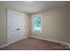 Bedroom featuring a window and spacious closet space at 110 Leeper Ave, Belmont, NC 28012