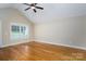Bedroom with hardwood flooring, a ceiling fan, and a window at 110 Leeper Ave, Belmont, NC 28012