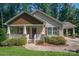 Beautiful home showcasing a charming covered porch and well-maintained shrubbery at 110 Leeper Ave, Belmont, NC 28012