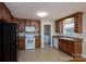 Well-equipped kitchen with ample cabinet space, appliances, and access to laundry area, for added convenience at 110 Leeper Ave, Belmont, NC 28012
