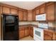 Functional kitchen featuring wooden cabinets, modern appliances, and ample countertop space at 110 Leeper Ave, Belmont, NC 28012