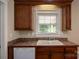 Kitchen area with ample countertop and cabinet space along with a view of the sink and yard at 110 Leeper Ave, Belmont, NC 28012