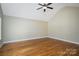 Bright and airy main bedroom with hardwood floors, a vaulted ceiling, and ample natural light at 110 Leeper Ave, Belmont, NC 28012