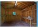 Image of shed interior featuring wood framing, workbench, and window at 110 Leeper Ave, Belmont, NC 28012