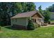 Side view of a well-kept home with a front porch and a lush green lawn at 110 Leeper Ave, Belmont, NC 28012