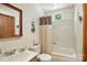 Bright bathroom with a shower-tub combination, decorative window above tub, and a decorative framed mirror at 1119 Palmyra Dr, Fort Mill, SC 29708