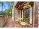 A cozy outdoor deck features a small dining set next to a sliding door, blending indoor and outdoor living at 1119 Palmyra Dr, Fort Mill, SC 29708
