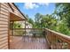 Charming deck features a bistro table and chairs, ideal for enjoying the serene outdoor setting and wooded view at 1119 Palmyra Dr, Fort Mill, SC 29708
