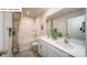 Well-lit bathroom featuring a double sink vanity with quartz countertops and a shower-tub combo at 119 Rustling Waters Dr, Mooresville, NC 28117