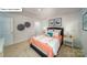 Comfortable bedroom featuring carpeted floors, bright bedding, and decorative wall art at 119 Rustling Waters Dr, Mooresville, NC 28117