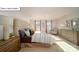 Bright primary bedroom showcasing a luxurious bed, ample natural light, and a serene atmosphere at 119 Rustling Waters Dr, Mooresville, NC 28117
