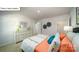 Stylish bedroom with carpeted floors, bright bedding, and a white dresser at 119 Rustling Waters Dr, Mooresville, NC 28117