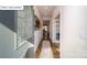 Inviting entryway with decorative door, hardwood floors, rug and view into the adjacent dining room at 119 Rustling Waters Dr, Mooresville, NC 28117