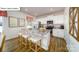 Modern kitchen with granite countertops, stainless steel appliances, and a breakfast bar with stools at 119 Rustling Waters Dr, Mooresville, NC 28117