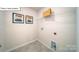 Functional laundry room equipped with washer/dryer connections and storage for convenience at 119 Rustling Waters Dr, Mooresville, NC 28117