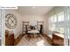 Bright home office featuring French doors, hardwood floors, a desk, and built-in shelves at 119 Rustling Waters Dr, Mooresville, NC 28117