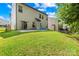 Exterior backyard view of property including grassy area and home structure at 120 Carolinian Dr, Statesville, NC 28677