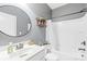 Bathroom features a sink with large mirror, a bathtub and shower combination at 120 Carolinian Dr, Statesville, NC 28677