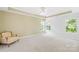 Large bedroom with neutral wall color and natural light from three windows at 120 Carolinian Dr, Statesville, NC 28677