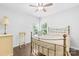 Bedroom with wood floor, natural light from windows, and neutral decor at 120 Carolinian Dr, Statesville, NC 28677