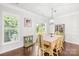 Bright dining room with hardwood floors, modern lighting, and sliding glass door at 120 Carolinian Dr, Statesville, NC 28677