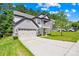 Charming two-story home with a two car garage, a front porch, and a well-manicured lawn at 120 Carolinian Dr, Statesville, NC 28677